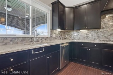 Custom built ranch with finished basement & a covered 288 sf on The Orchards Golf Club in Michigan - for sale on GolfHomes.com, golf home, golf lot