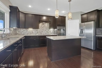 Custom built ranch with finished basement & a covered 288 sf on The Orchards Golf Club in Michigan - for sale on GolfHomes.com, golf home, golf lot