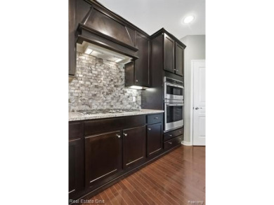 Custom built ranch with finished basement & a covered 288 sf on The Orchards Golf Club in Michigan - for sale on GolfHomes.com, golf home, golf lot