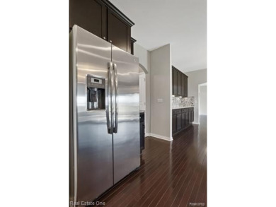 Custom built ranch with finished basement & a covered 288 sf on The Orchards Golf Club in Michigan - for sale on GolfHomes.com, golf home, golf lot