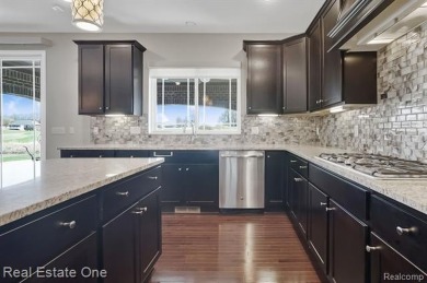 Custom built ranch with finished basement & a covered 288 sf on The Orchards Golf Club in Michigan - for sale on GolfHomes.com, golf home, golf lot