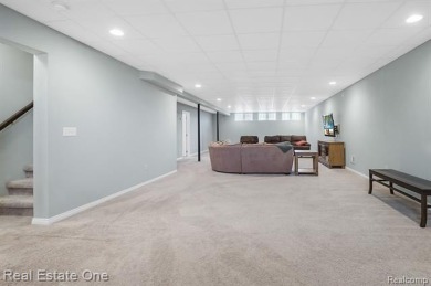 Custom built ranch with finished basement & a covered 288 sf on The Orchards Golf Club in Michigan - for sale on GolfHomes.com, golf home, golf lot