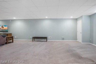 Custom built ranch with finished basement & a covered 288 sf on The Orchards Golf Club in Michigan - for sale on GolfHomes.com, golf home, golf lot
