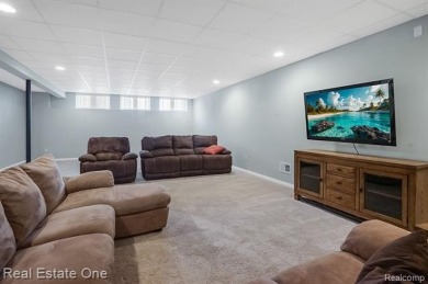 Custom built ranch with finished basement & a covered 288 sf on The Orchards Golf Club in Michigan - for sale on GolfHomes.com, golf home, golf lot