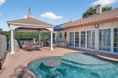 Welcome to this exceptional residence where charm, comfort, and on Woodmont Country Club in Florida - for sale on GolfHomes.com, golf home, golf lot