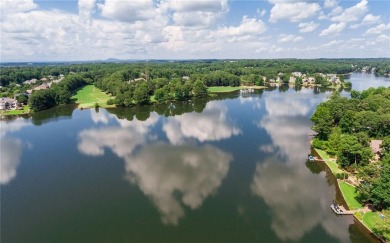 Stunning Lake Windward residence offers expansive Lake and Golf on The Golf Club of Georgia in Georgia - for sale on GolfHomes.com, golf home, golf lot