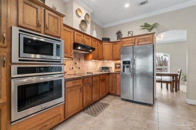 Welcome to this elevated Gulf Breeze retreat where timeless on Tiger Point Golf and Country Club in Florida - for sale on GolfHomes.com, golf home, golf lot