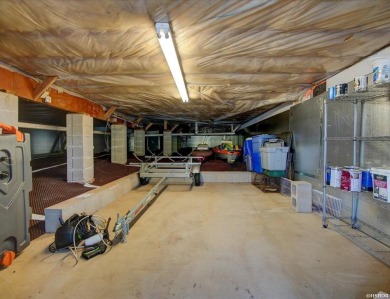 Discover your dream home that boasts breathtaking lake and golf on Diamondhead Golf and Country Club in Arkansas - for sale on GolfHomes.com, golf home, golf lot