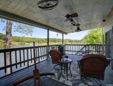 Discover your dream home that boasts breathtaking lake and golf on Diamondhead Golf and Country Club in Arkansas - for sale on GolfHomes.com, golf home, golf lot