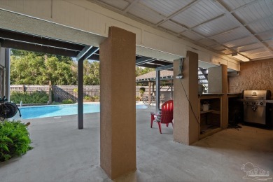 Welcome to this elevated Gulf Breeze retreat where timeless on Tiger Point Golf and Country Club in Florida - for sale on GolfHomes.com, golf home, golf lot