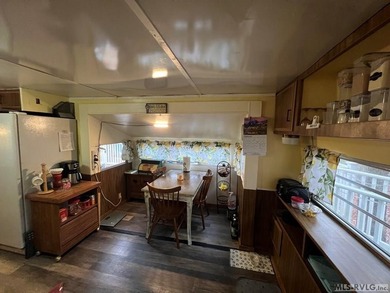 Large 2 lot, 2 bedroom, 1 bath home. Large back deck for on River Ridge Golf Club in Virginia - for sale on GolfHomes.com, golf home, golf lot