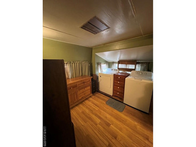 Large 2 lot, 2 bedroom, 1 bath home. Large back deck for on River Ridge Golf Club in Virginia - for sale on GolfHomes.com, golf home, golf lot