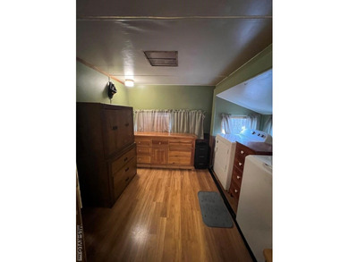 Large 2 lot, 2 bedroom, 1 bath home. Large back deck for on River Ridge Golf Club in Virginia - for sale on GolfHomes.com, golf home, golf lot