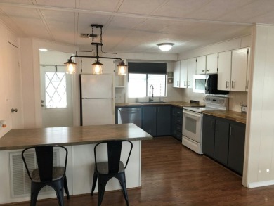 This open floor plan offers a specious kitchen with lots of on Fairways Country Club in Florida - for sale on GolfHomes.com, golf home, golf lot