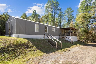 Discover the perfect getaway with this 3 bedroom, 2 bathroom on Rayburn Country Club in Texas - for sale on GolfHomes.com, golf home, golf lot