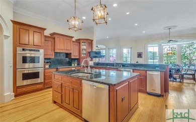 Experience the epitome of Southern elegance at this custom on Savannah Quarters Country Club in Georgia - for sale on GolfHomes.com, golf home, golf lot