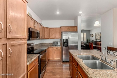Presenting a beautifully maintained and expanded 2-bedroom plus on Arizona Traditions Golf Club in Arizona - for sale on GolfHomes.com, golf home, golf lot