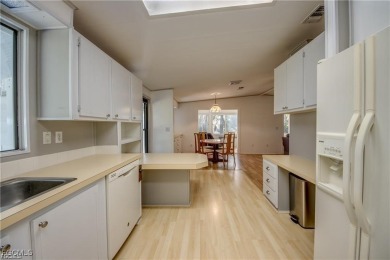 Remodeled with a new roof, new garage for golf cart, and a on Lake Fairways Country Club in Florida - for sale on GolfHomes.com, golf home, golf lot