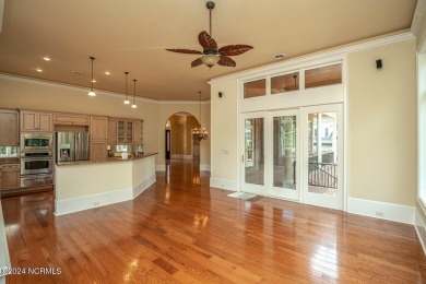 A home built for comfort and entertaining awaits you.  The front on Ocean Ridge Plantation in North Carolina - for sale on GolfHomes.com, golf home, golf lot