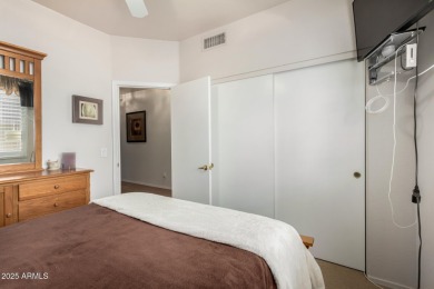 Presenting a beautifully maintained and expanded 2-bedroom plus on Arizona Traditions Golf Club in Arizona - for sale on GolfHomes.com, golf home, golf lot