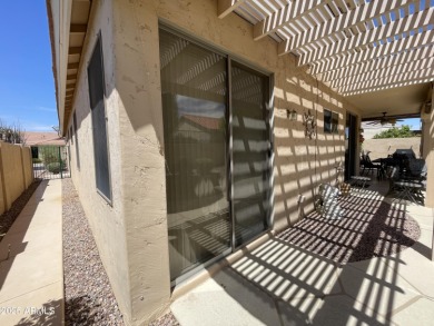 Presenting a beautifully maintained and expanded 2-bedroom plus on Arizona Traditions Golf Club in Arizona - for sale on GolfHomes.com, golf home, golf lot