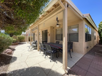 Presenting a beautifully maintained and expanded 2-bedroom plus on Arizona Traditions Golf Club in Arizona - for sale on GolfHomes.com, golf home, golf lot