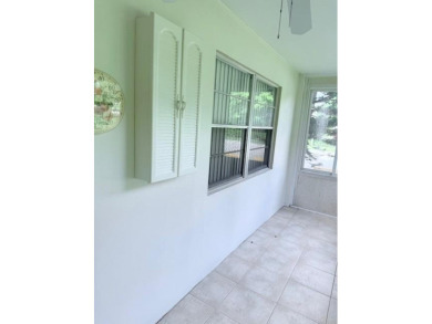 1st floor corner 2 bedroom,2 bath quiet Tilford location on Hillsboro Pines Golf in Florida - for sale on GolfHomes.com, golf home, golf lot