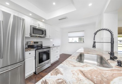 Welcome to your new home in The Mainlands of Tamarac by the on Mainlands Golf Club in Florida - for sale on GolfHomes.com, golf home, golf lot