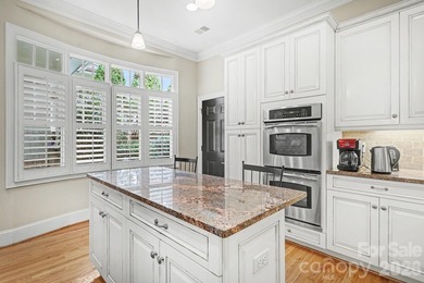 Handsome townhome tucked behind the 15th green of Raintree's on Raintree Country Club in North Carolina - for sale on GolfHomes.com, golf home, golf lot