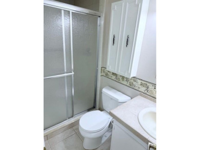 1st floor corner 2 bedroom,2 bath quiet Tilford location on Hillsboro Pines Golf in Florida - for sale on GolfHomes.com, golf home, golf lot