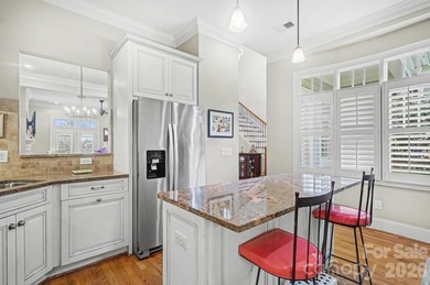 Handsome townhome tucked behind the 15th green of Raintree's on Raintree Country Club in North Carolina - for sale on GolfHomes.com, golf home, golf lot