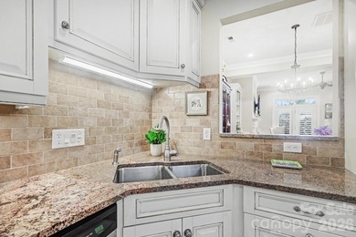 Handsome townhome tucked behind the 15th green of Raintree's on Raintree Country Club in North Carolina - for sale on GolfHomes.com, golf home, golf lot