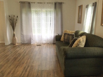 This home recently underwent a total rehab.  New vinyl plank on Spanish Lakes I in Florida - for sale on GolfHomes.com, golf home, golf lot