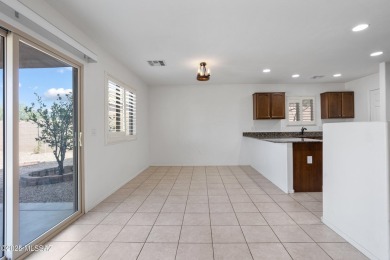 Located in Rancho Vistoso, this Elevation C Plan with Stone sits on The Golf Club at Vistoso in Arizona - for sale on GolfHomes.com, golf home, golf lot