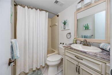 GORGEOUS & nestled on the golf greens with peaceful views, this on Isla Del Sol Yacht and Country Club in Florida - for sale on GolfHomes.com, golf home, golf lot
