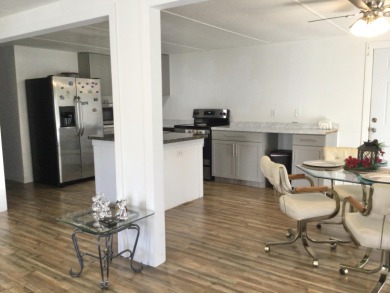This home recently underwent a total rehab.  New vinyl plank on Spanish Lakes I in Florida - for sale on GolfHomes.com, golf home, golf lot
