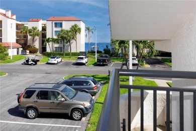 GORGEOUS & nestled on the golf greens with peaceful views, this on Isla Del Sol Yacht and Country Club in Florida - for sale on GolfHomes.com, golf home, golf lot