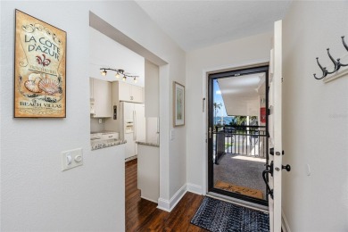 GORGEOUS & nestled on the golf greens with peaceful views, this on Isla Del Sol Yacht and Country Club in Florida - for sale on GolfHomes.com, golf home, golf lot