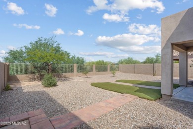 Located in Rancho Vistoso, this Elevation C Plan with Stone sits on The Golf Club at Vistoso in Arizona - for sale on GolfHomes.com, golf home, golf lot