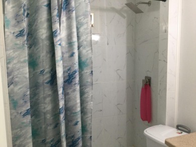 This home recently underwent a total rehab.  New vinyl plank on Spanish Lakes I in Florida - for sale on GolfHomes.com, golf home, golf lot