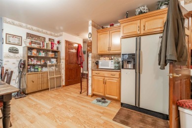 Spacious 3-Bedroom Home with Bonus Spaces and Ample Storage Near on Northern Bay Golf Resort and Marina in Wisconsin - for sale on GolfHomes.com, golf home, golf lot