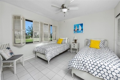 GORGEOUS & nestled on the golf greens with peaceful views, this on Isla Del Sol Yacht and Country Club in Florida - for sale on GolfHomes.com, golf home, golf lot