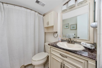 GORGEOUS & nestled on the golf greens with peaceful views, this on Isla Del Sol Yacht and Country Club in Florida - for sale on GolfHomes.com, golf home, golf lot