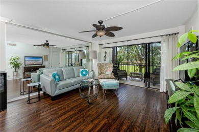 GORGEOUS & nestled on the golf greens with peaceful views, this on Isla Del Sol Yacht and Country Club in Florida - for sale on GolfHomes.com, golf home, golf lot