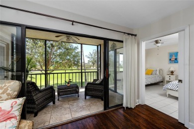 GORGEOUS & nestled on the golf greens with peaceful views, this on Isla Del Sol Yacht and Country Club in Florida - for sale on GolfHomes.com, golf home, golf lot
