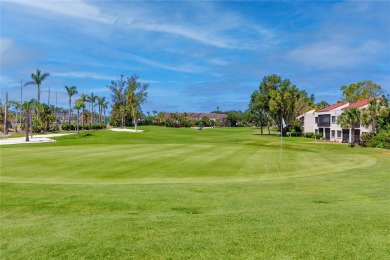 GORGEOUS & nestled on the golf greens with peaceful views, this on Isla Del Sol Yacht and Country Club in Florida - for sale on GolfHomes.com, golf home, golf lot