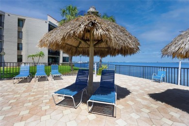 GORGEOUS & nestled on the golf greens with peaceful views, this on Isla Del Sol Yacht and Country Club in Florida - for sale on GolfHomes.com, golf home, golf lot