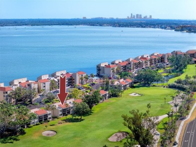 GORGEOUS & nestled on the golf greens with peaceful views, this on Isla Del Sol Yacht and Country Club in Florida - for sale on GolfHomes.com, golf home, golf lot
