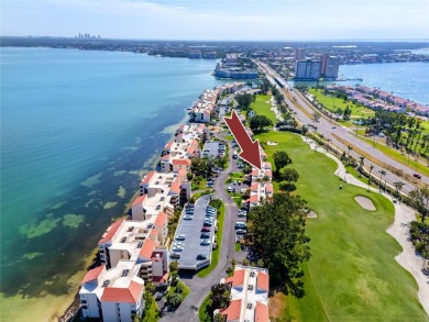 GORGEOUS & nestled on the golf greens with peaceful views, this on Isla Del Sol Yacht and Country Club in Florida - for sale on GolfHomes.com, golf home, golf lot