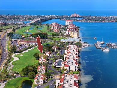 GORGEOUS & nestled on the golf greens with peaceful views, this on Isla Del Sol Yacht and Country Club in Florida - for sale on GolfHomes.com, golf home, golf lot
